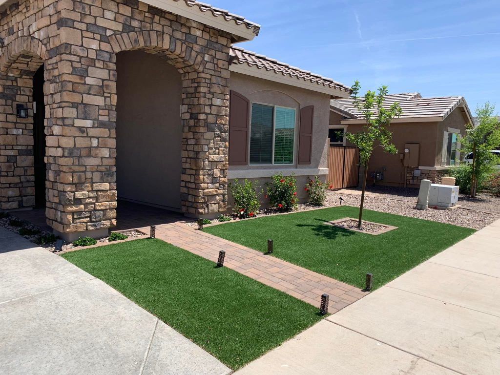 Plote Professional Services completed a landscape design and rock facade on this home in the east valley complete with turf and paver installation