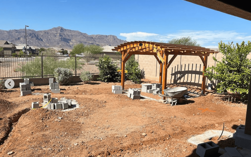 before shot of a scenic backyard as we installed a pergola