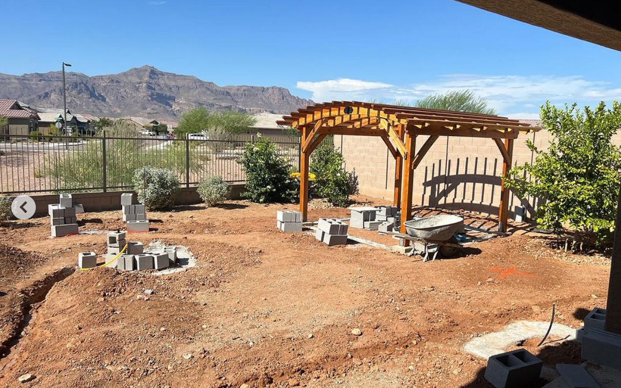 before shot of a scenic backyard as we installed a pergola